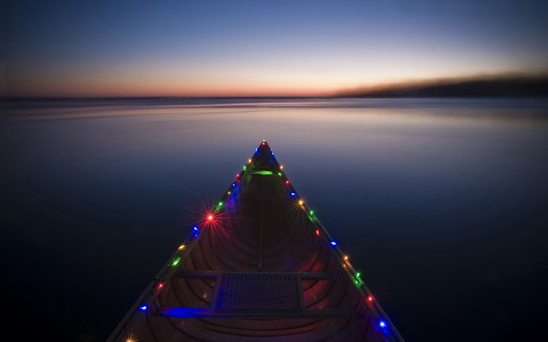 in the lights boat river colorful sea sunset water holidays garland horizon