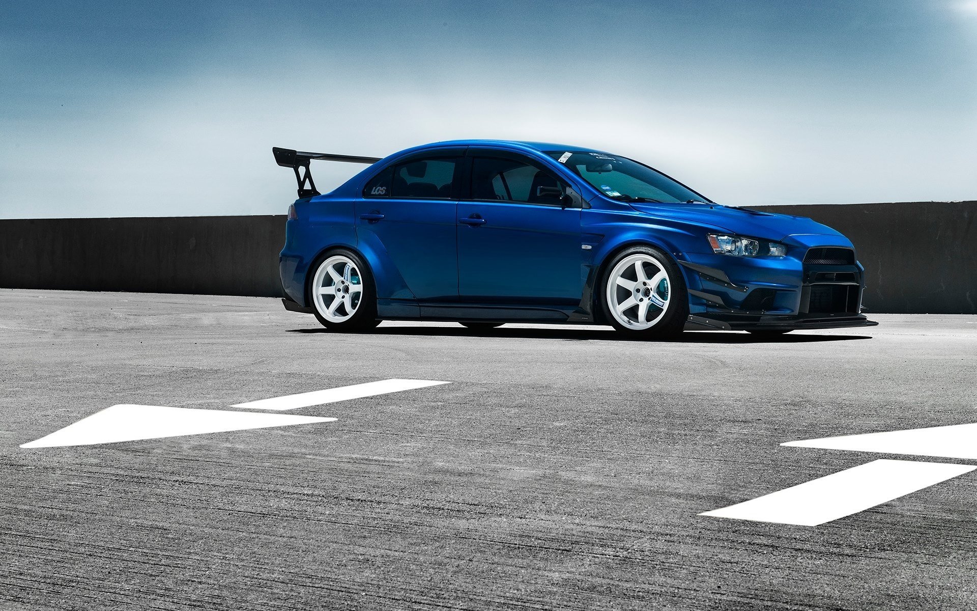 mitsubishi lancer evolution x blue car spoiler wheels front