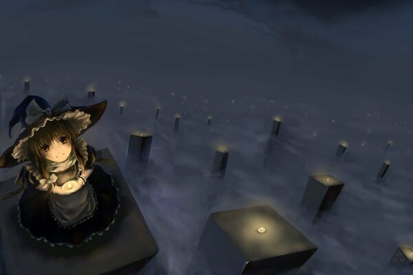 A girl with a candle in her hands in the fog