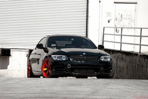 Black BMW e92 with red wheels