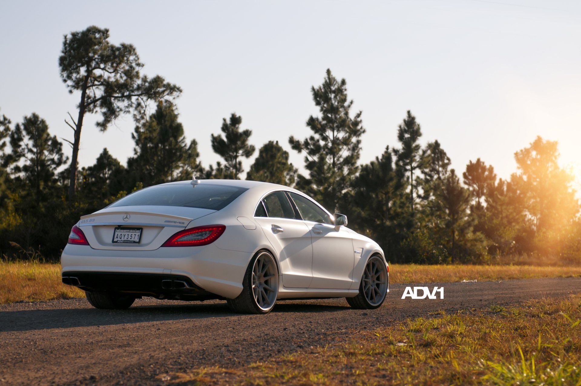 mercedes-benz cls63 amg mercedes tsls63 sedan white rear view road tree adv.1