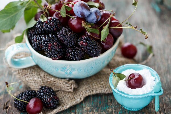 Beautiful berries on a blue saucer