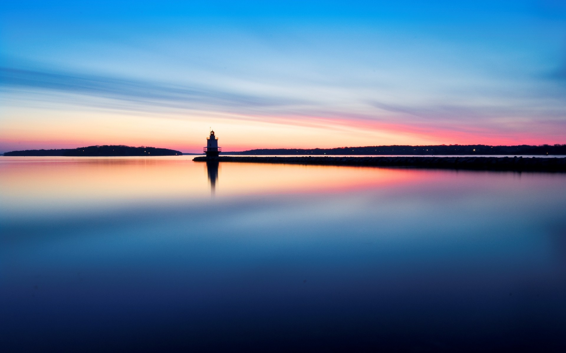 lighthouse water reflection morning