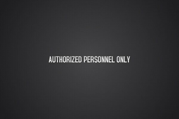The inscription authorized personnel on a black background