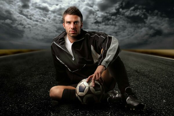 A famous football player with a ball in his hands