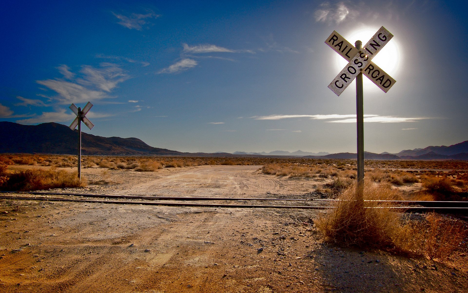 landscapes grass desert deserts railway railway rails sleepers sun mountains clouds cloud road roads intersection