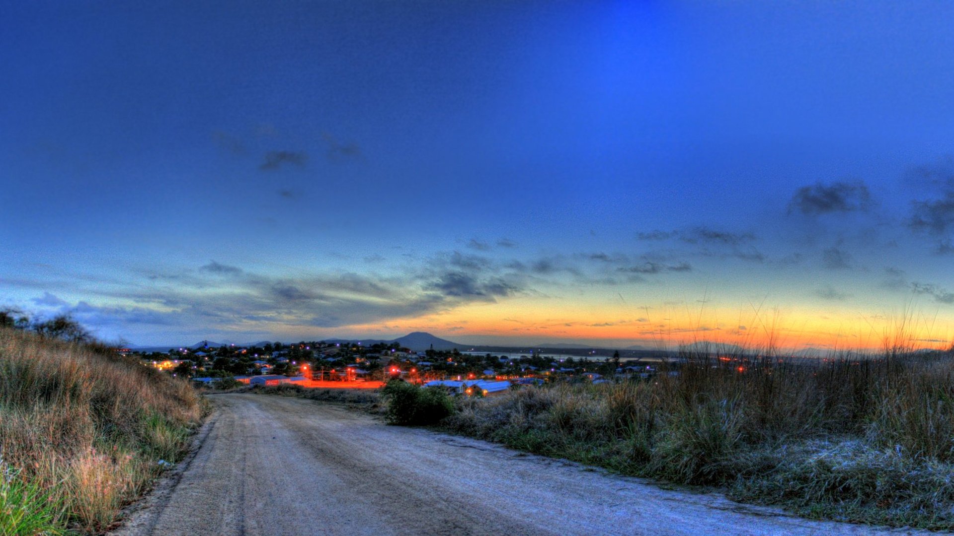 ky sunset night town lights road