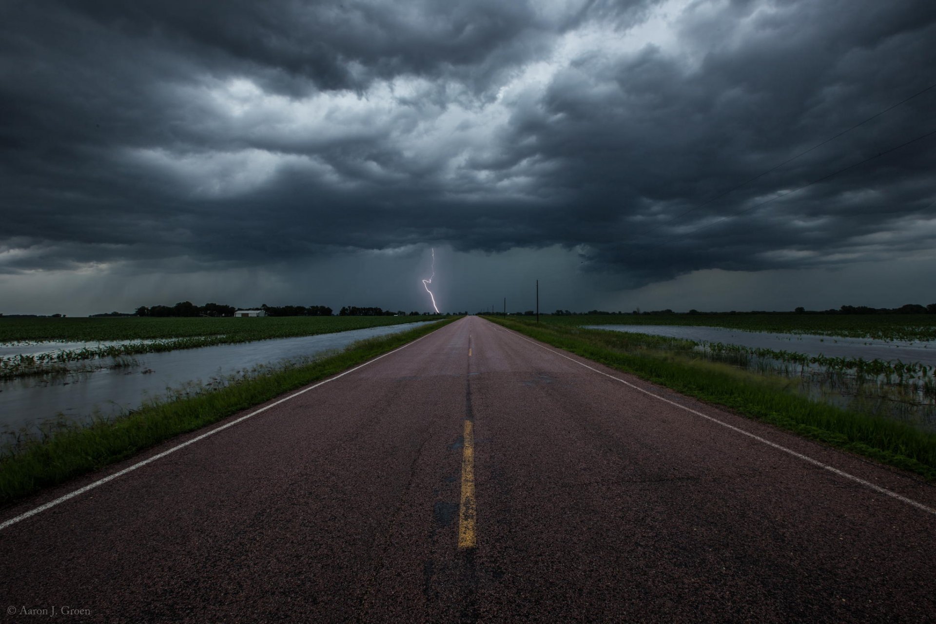 road the storm clouds lightning