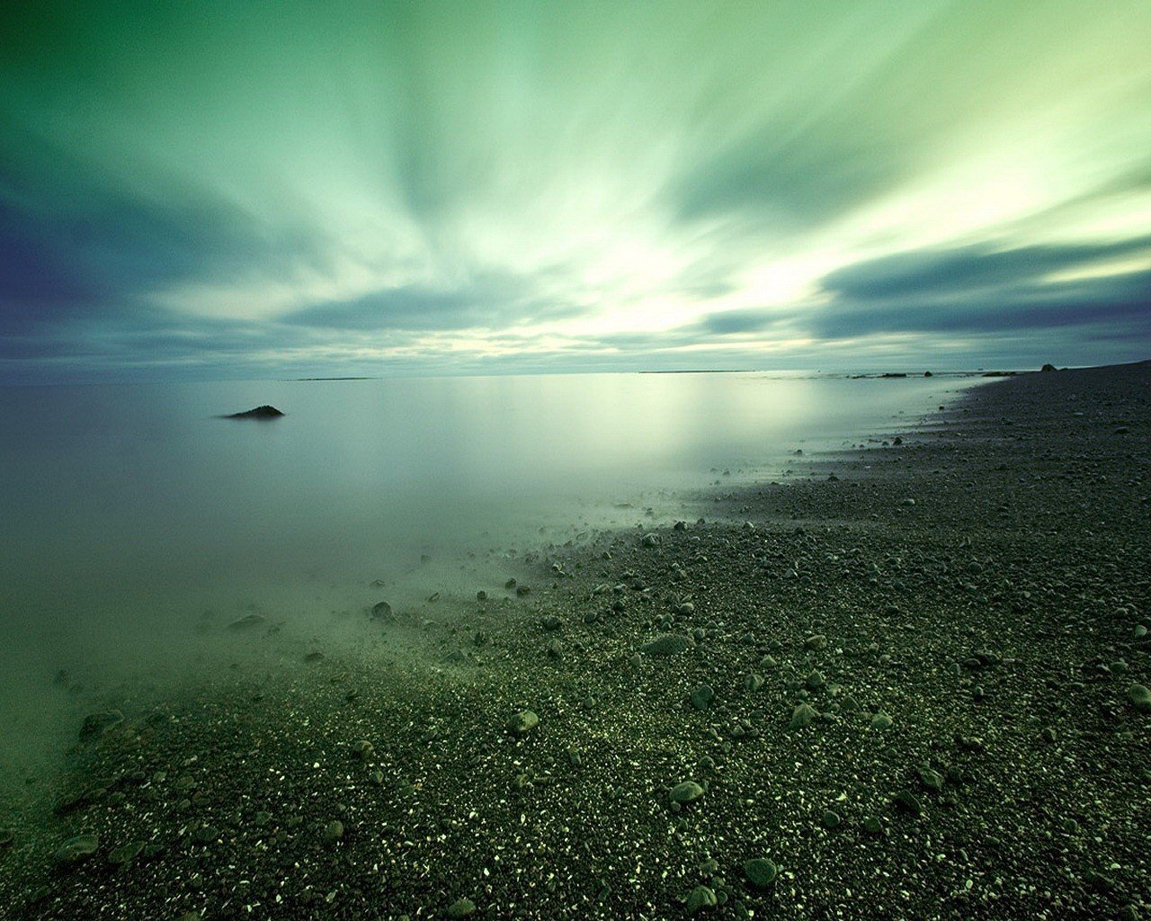 beach stones water cloud
