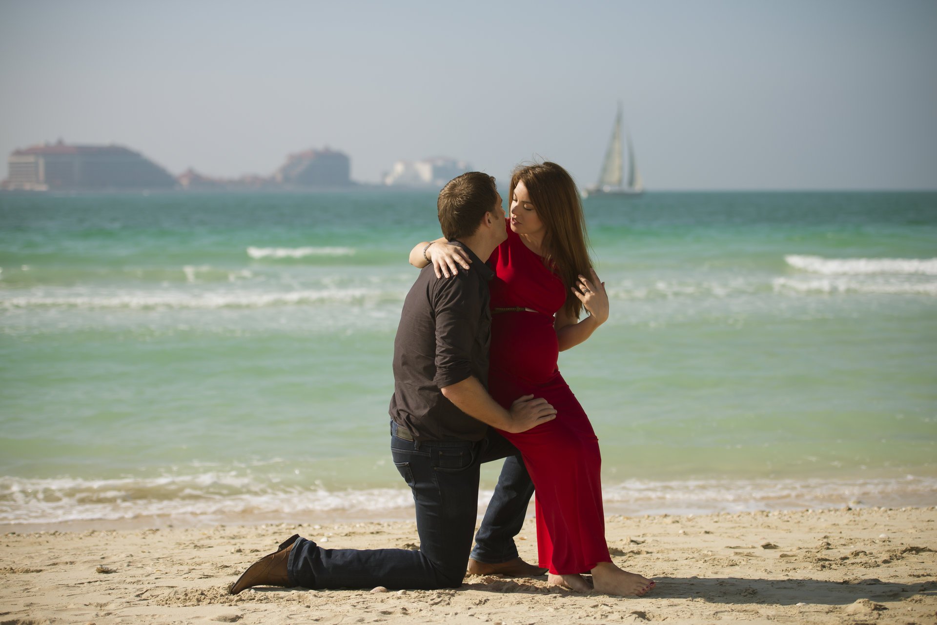 girl guy young man sea beach sand sailboats landscape