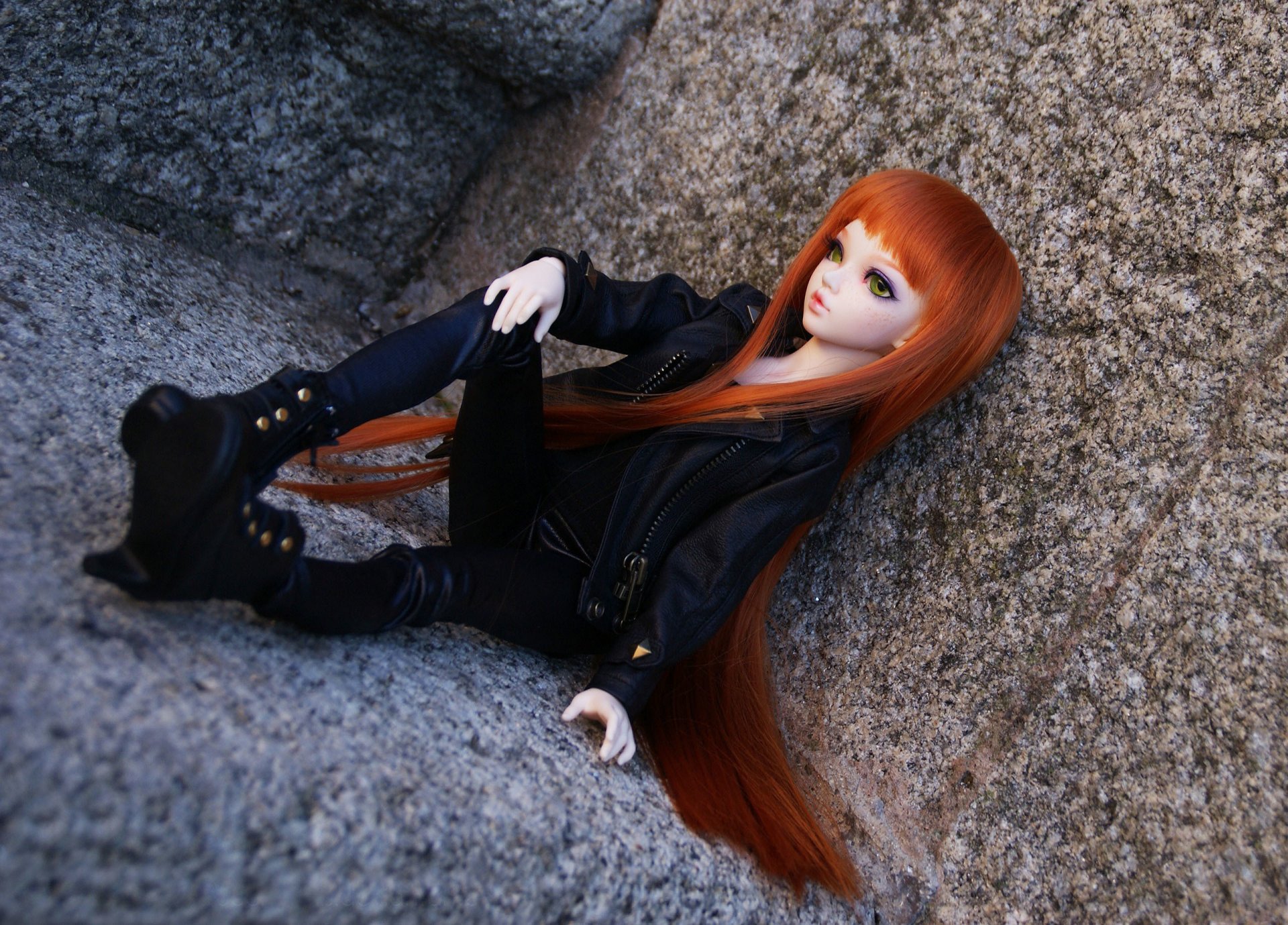 doll toys angle red long hair clothing sitting stone