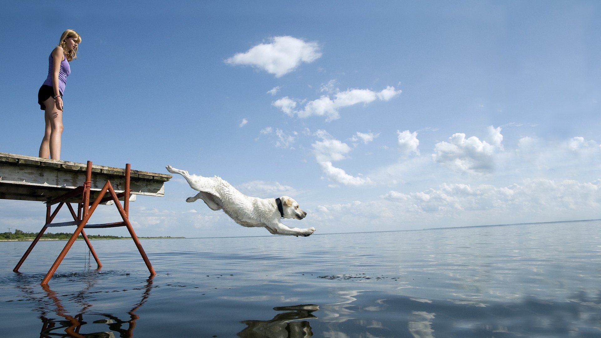 girl pier water jump white horizon sky
