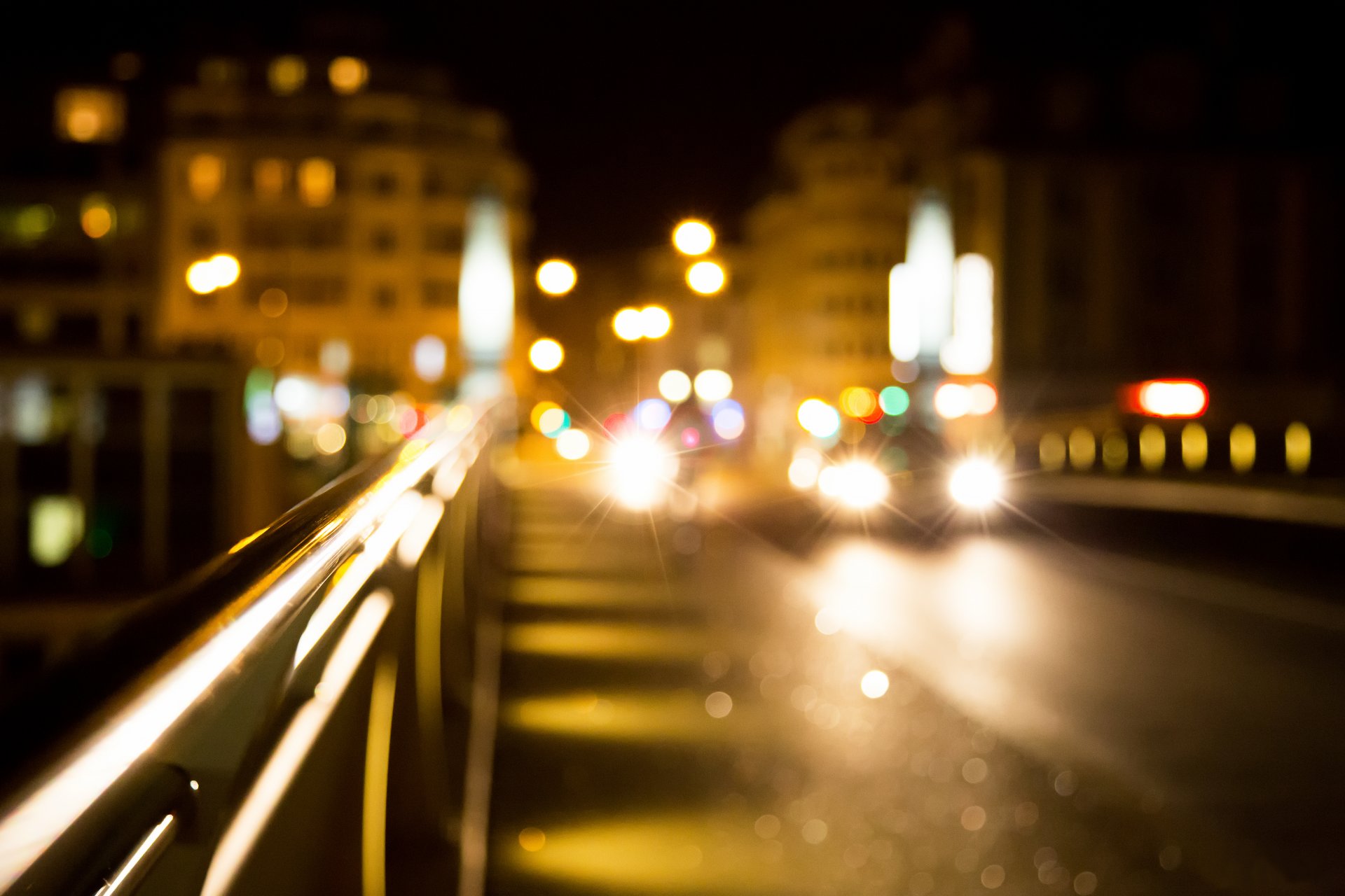 city night houses cars headlights road lights light bokeh blur
