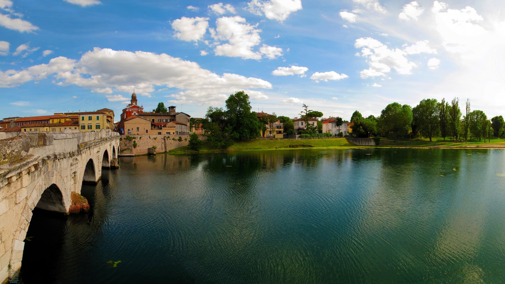 italy emilia-romagna rimini town river bridge tree sky photo