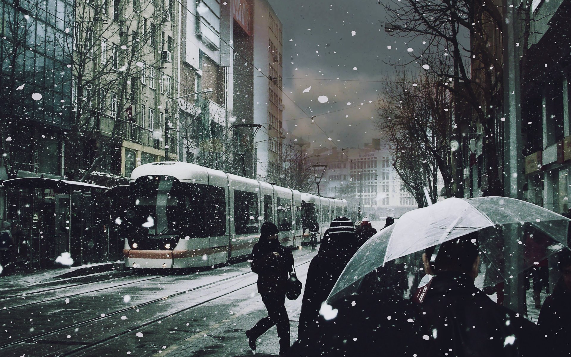 the tram people snow umbrella