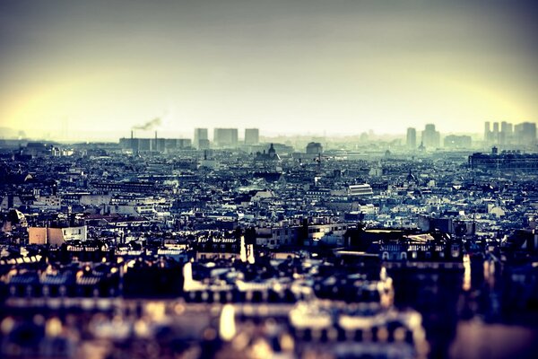 Urban haze on the background of roofs
