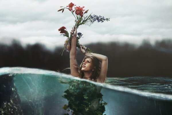 Photo of a girl in the water with flowers