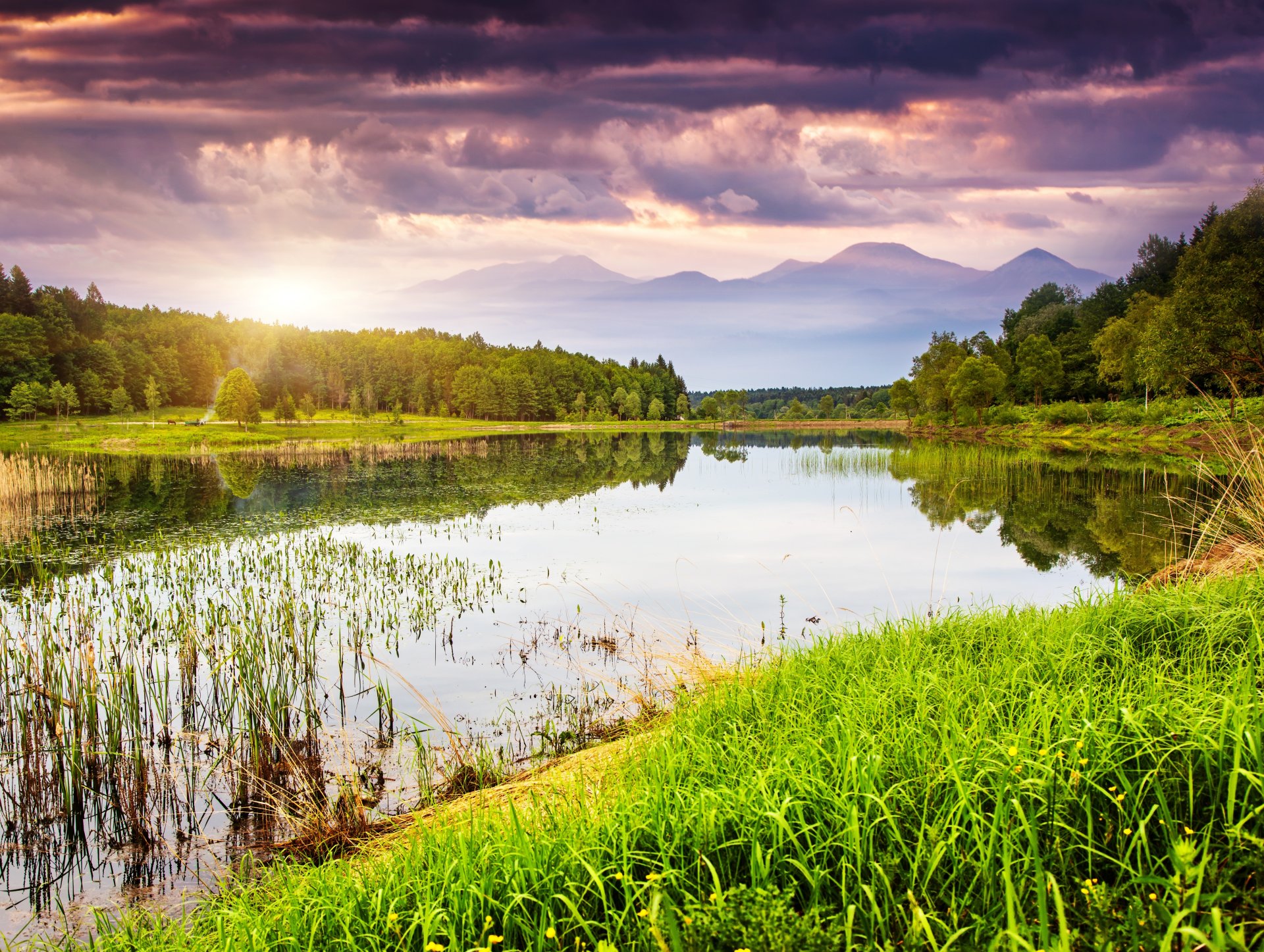 nature landscape lake water grass tree green mountain sky sunset cloud