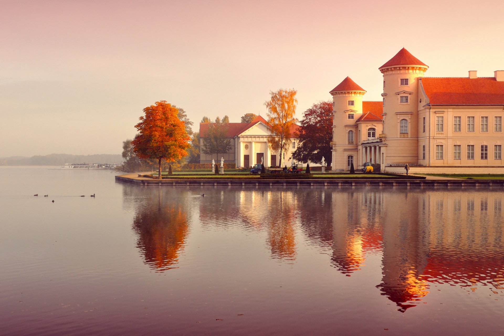 germany autumn buildings people trees leaves orange yellow water reflection morning fog nature landscape