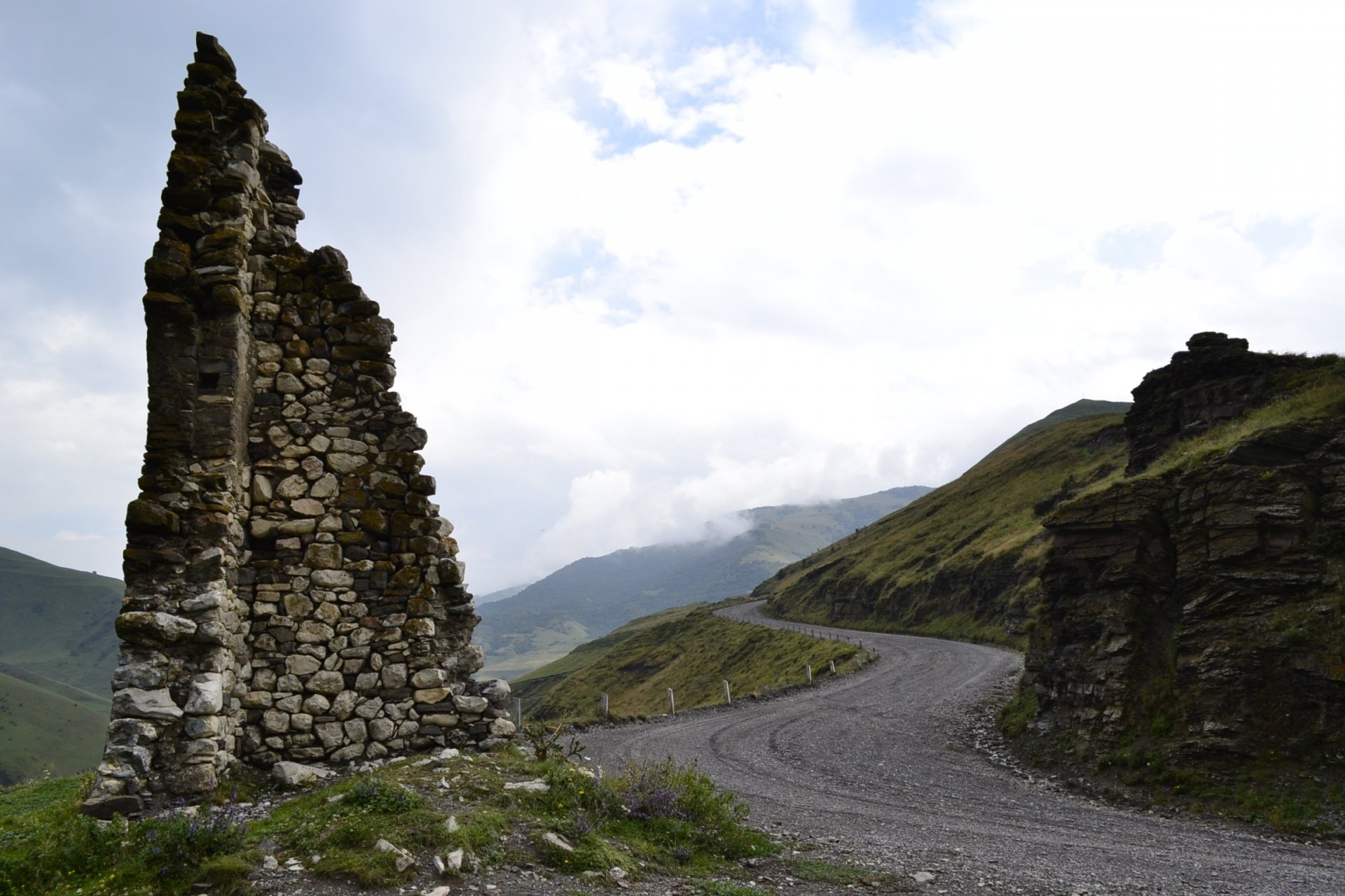russia mountains caucasus north ossetia fiagdon landscape nature sky road grass tower nothen ossetia hd