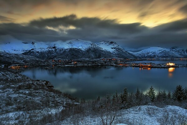 Night landscape in the mountains by the bay